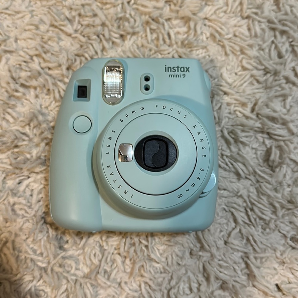 Blue Polaroid camera with a box,case,and many accessories pretty much brand new